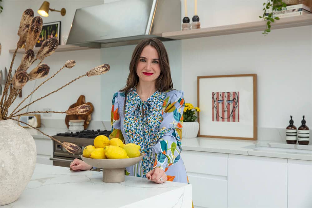 Rhian Pownceby in a white marble kitchen with lemons